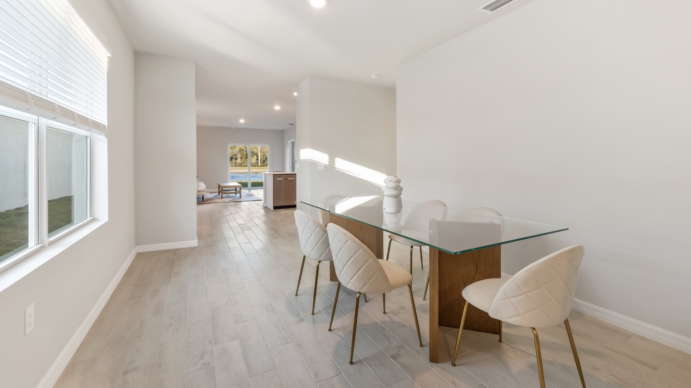 Dining area with natural light and vinyl flooring