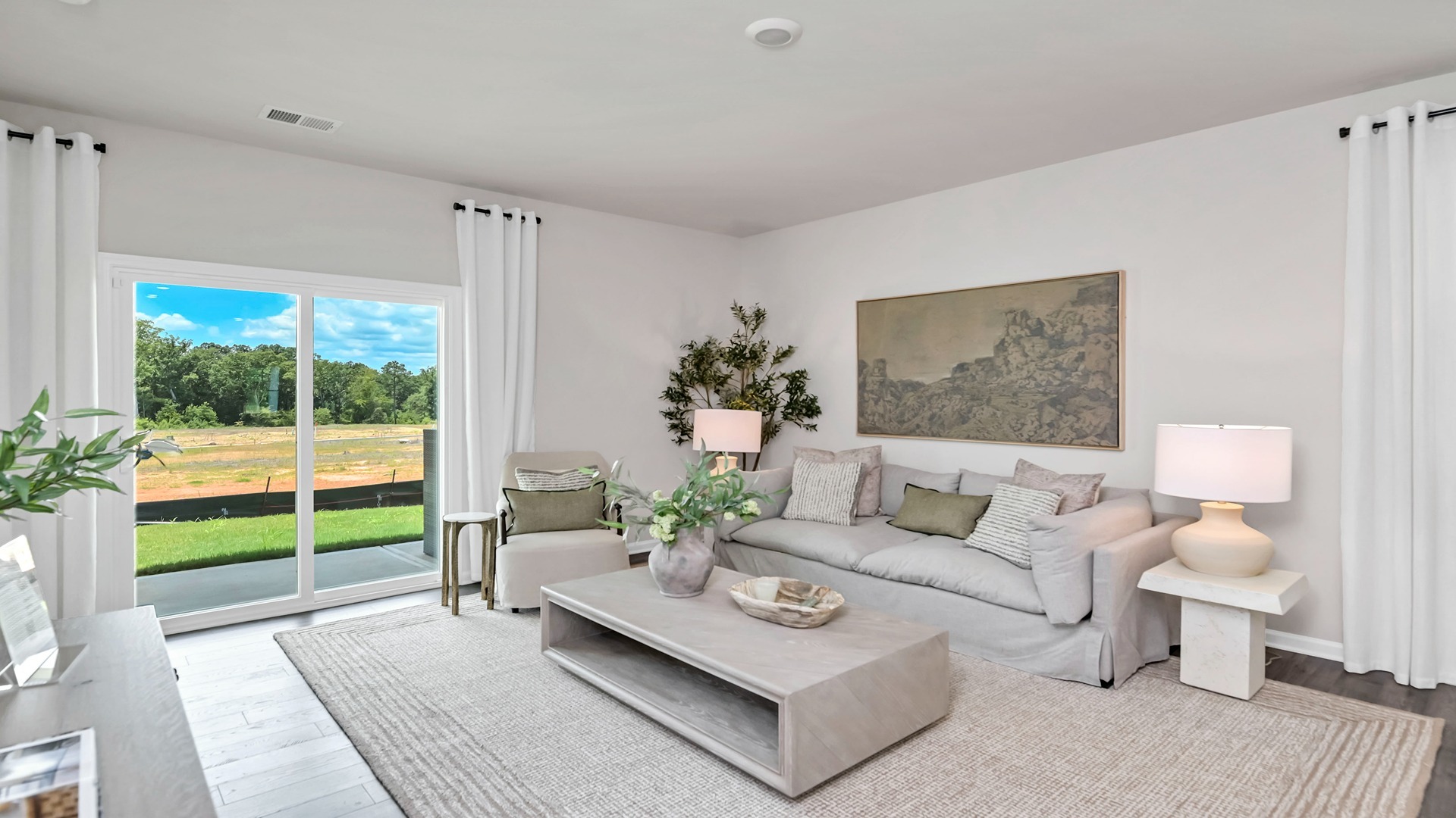 Living area with glass sliding doors leading to back patio