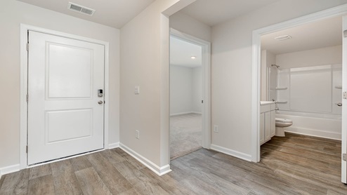 The entry way is spacious and bright leading to the living areas and bedroom