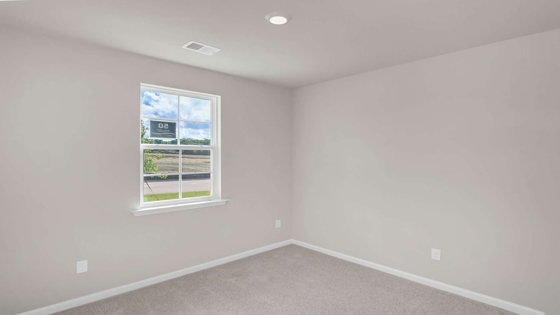 Bedroom 3 with a window and carpet flooring