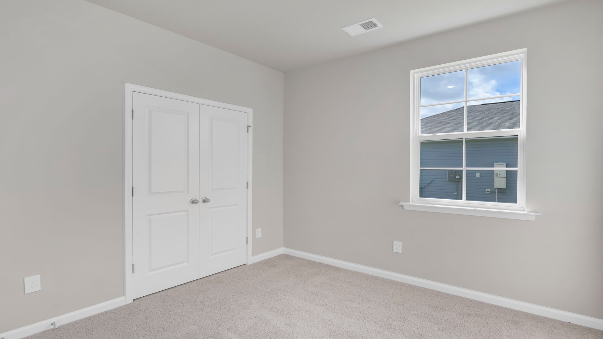 French closet doors in bedroom 2 of the Cameron floorplan