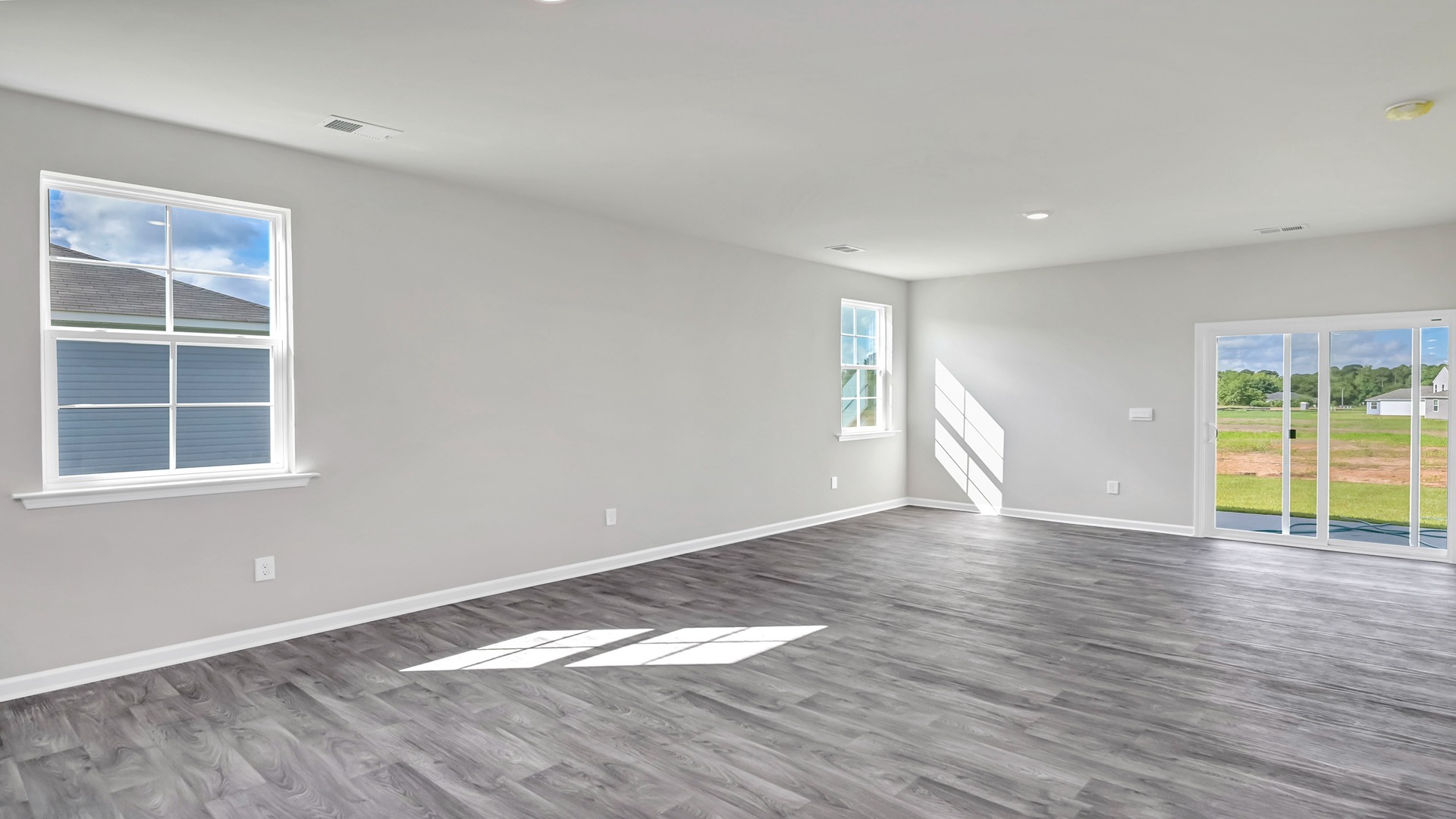 Main living areas are all open concept with several windows for warm, natural light