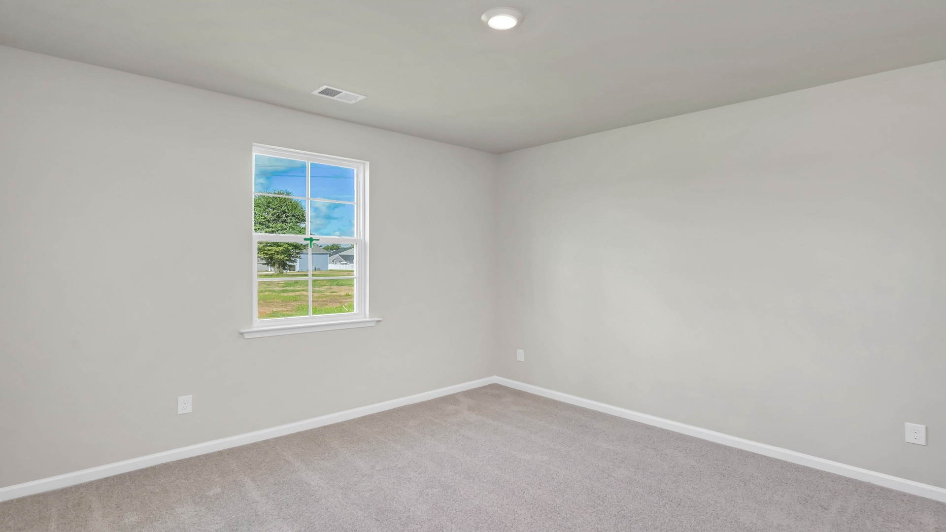 Primary bedroom privately tucked at the back of the home in Hopkins, SC