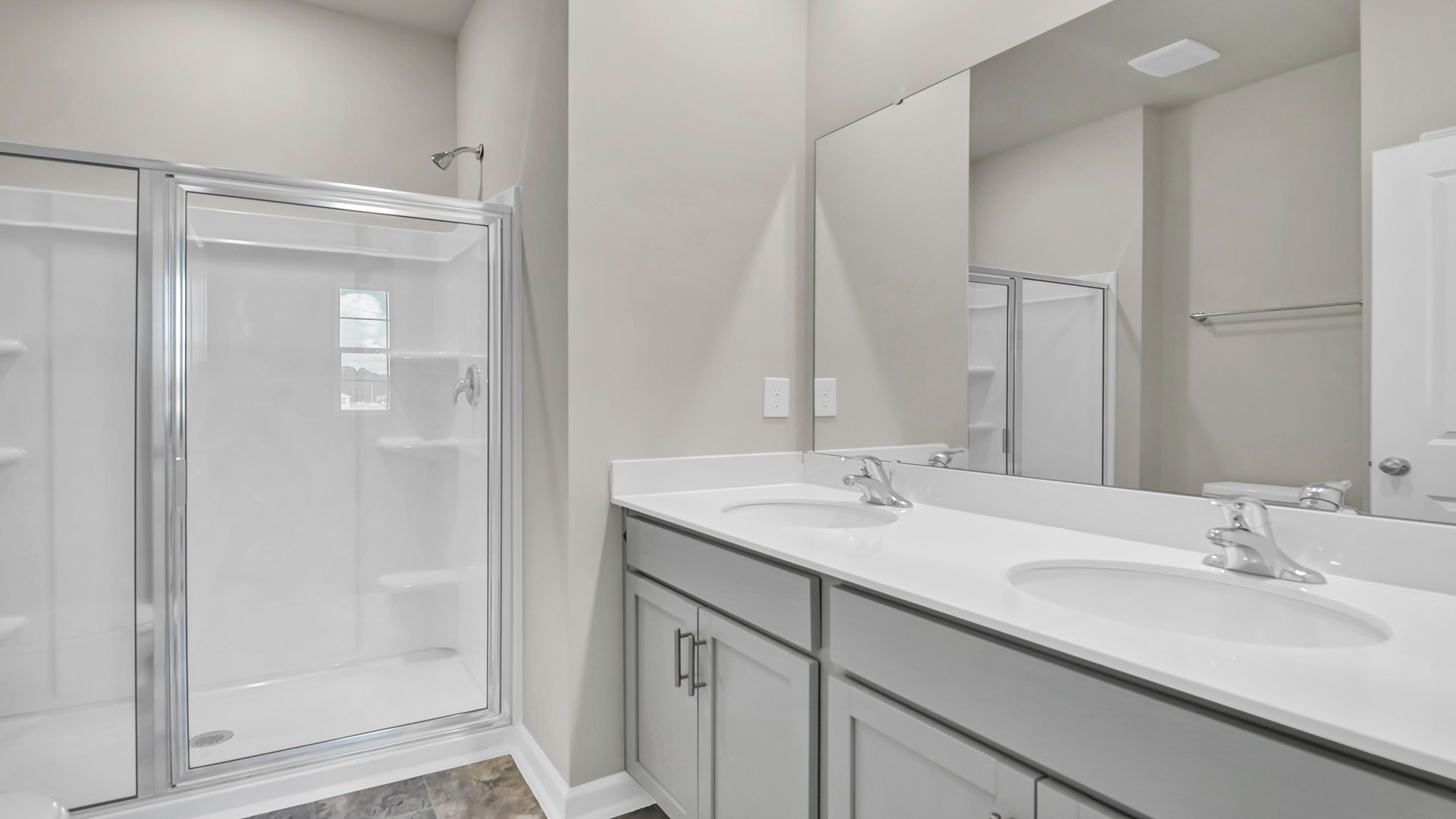 Standup primary shower in the primary bathroom of a new construction ranch-style home in Hopkins, SC