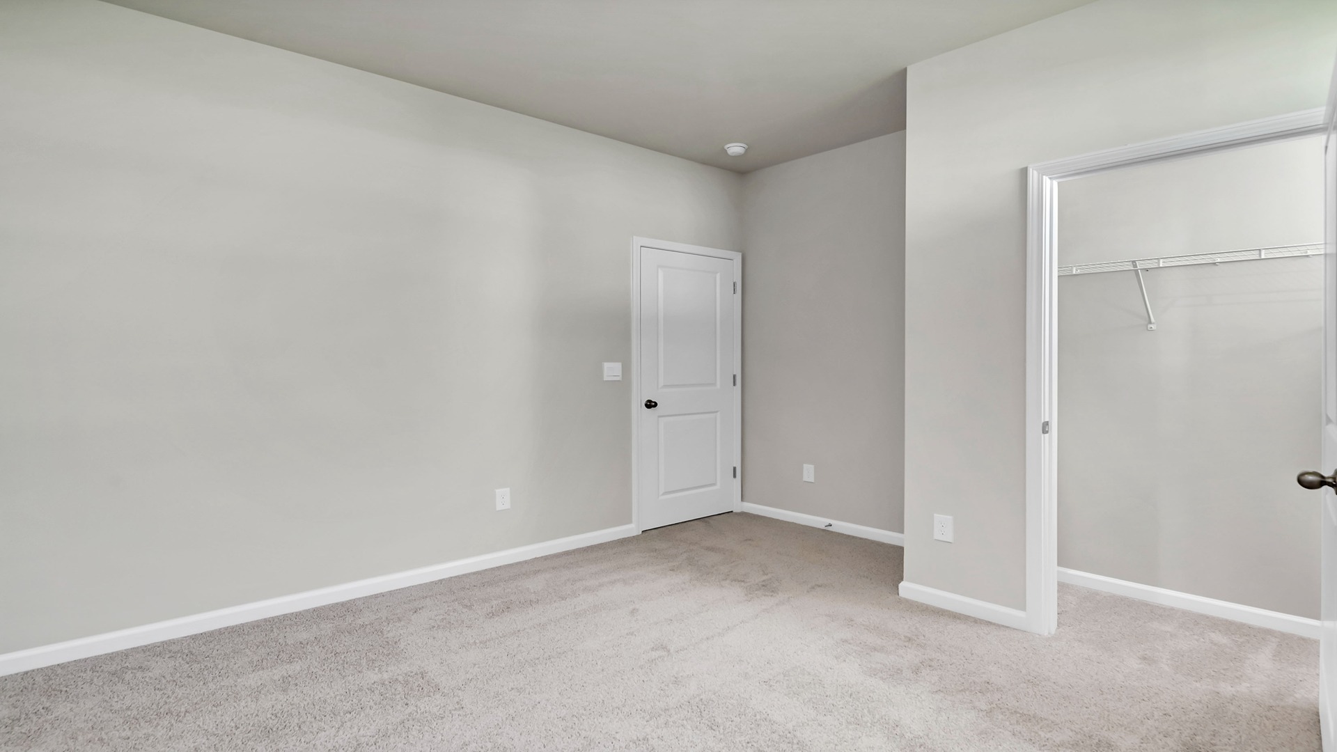 Bedroom 4 with carpet flooring and a private closet
