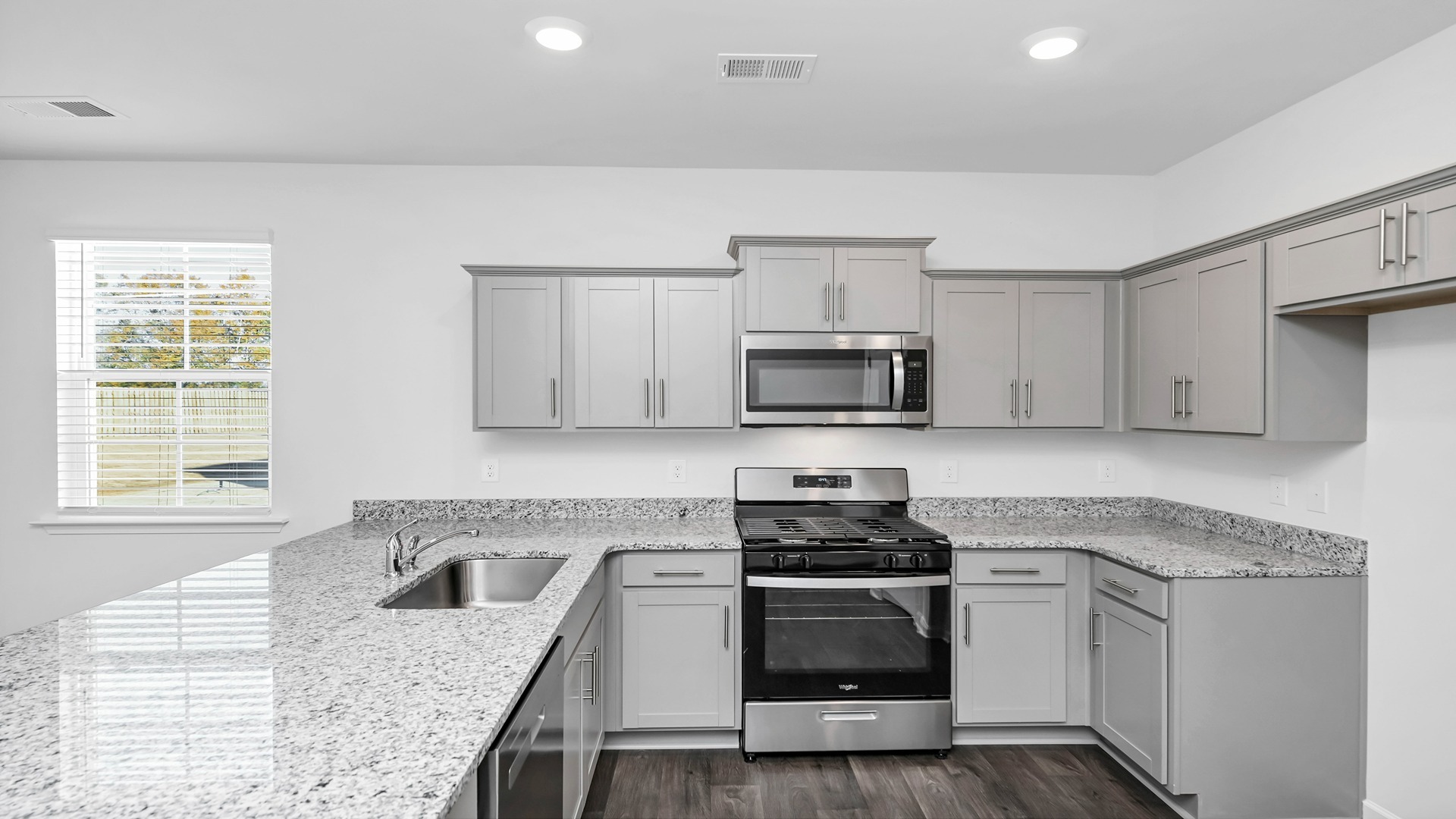 Cameron kitchen with granite countertops and grey cabinetry