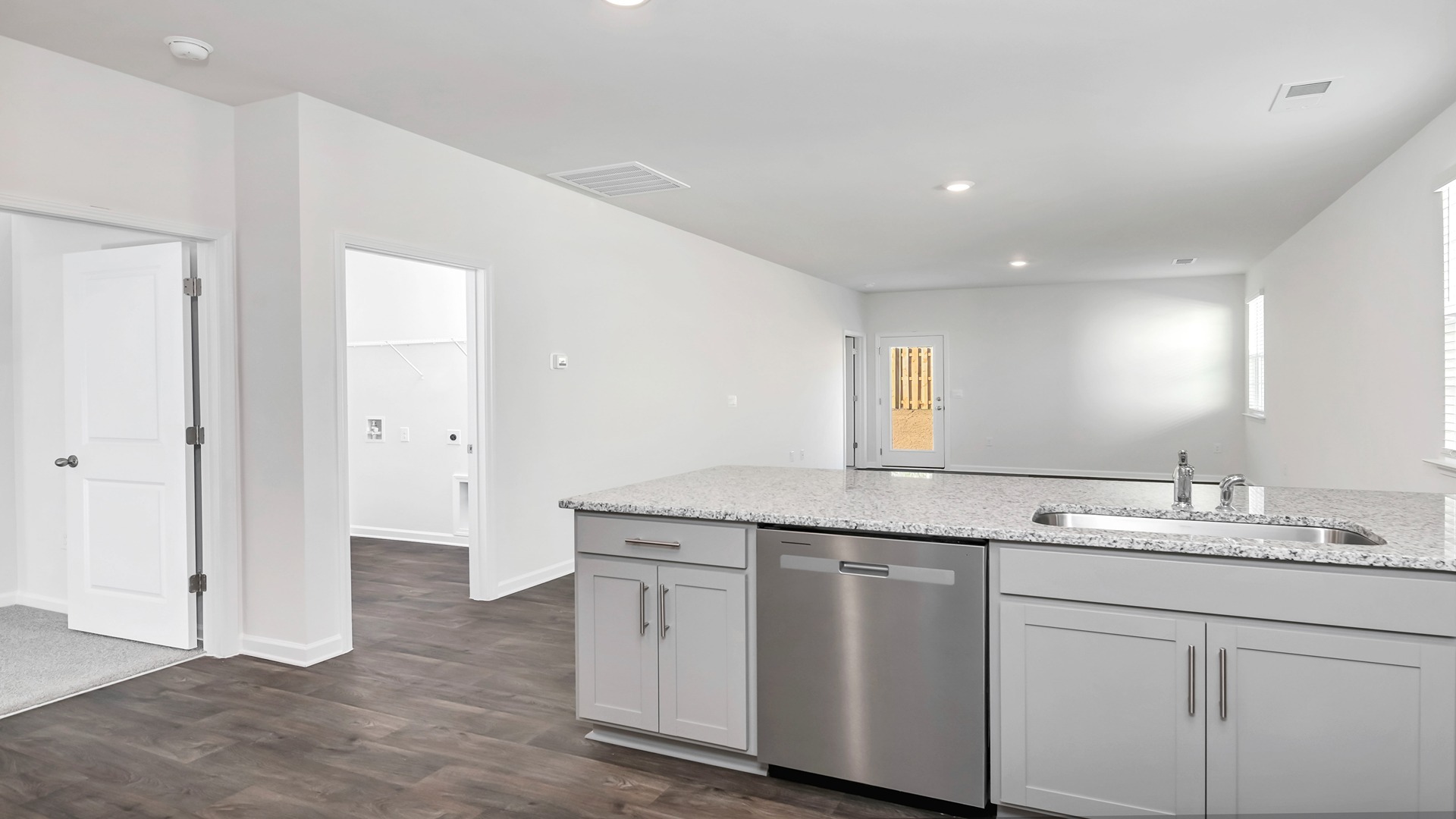 The floating kitchen island overlooks the living area