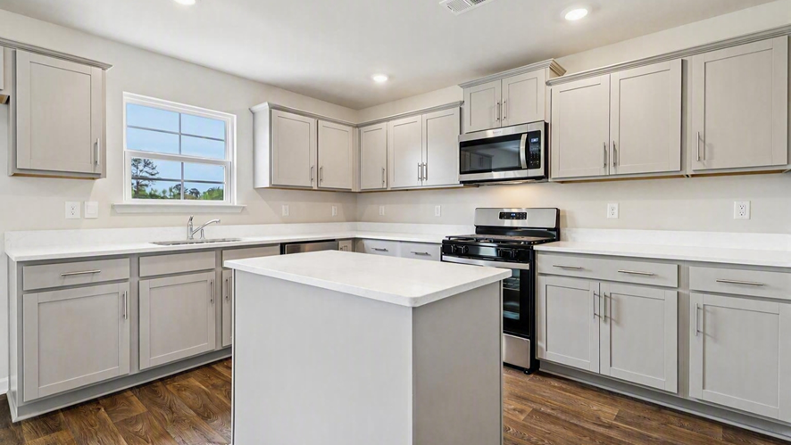 Modern kitchen in new home for sale with lots of cabinet and countertop space expanding on the walls