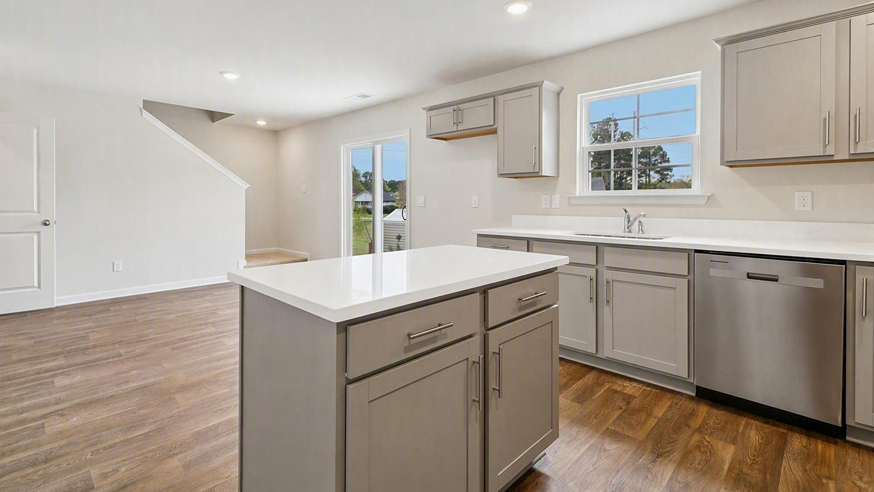 Floating kitchen island and quartz countertops in the Harrison kitchen