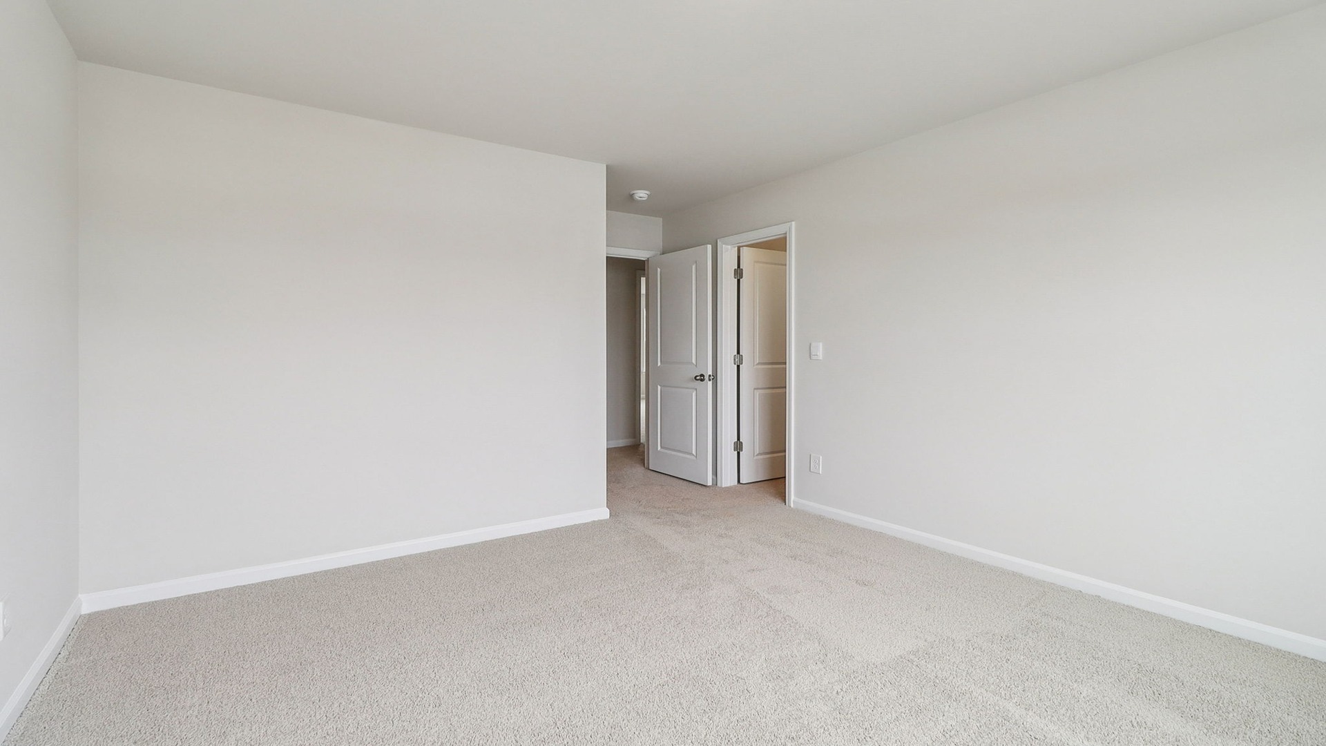 Bedroom 3 with walk-in primary closet
