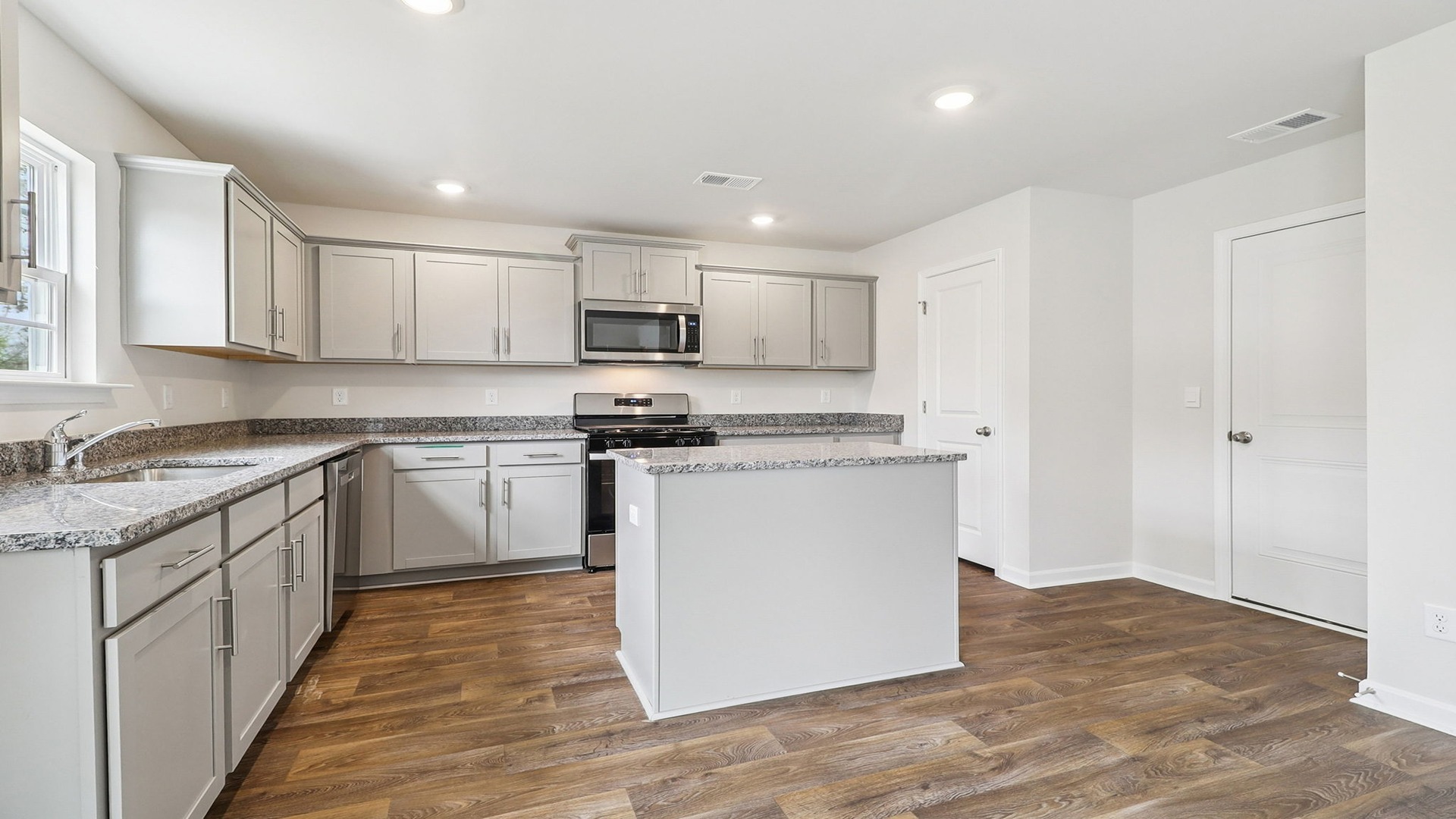 Pantry and access to garage in kitchen