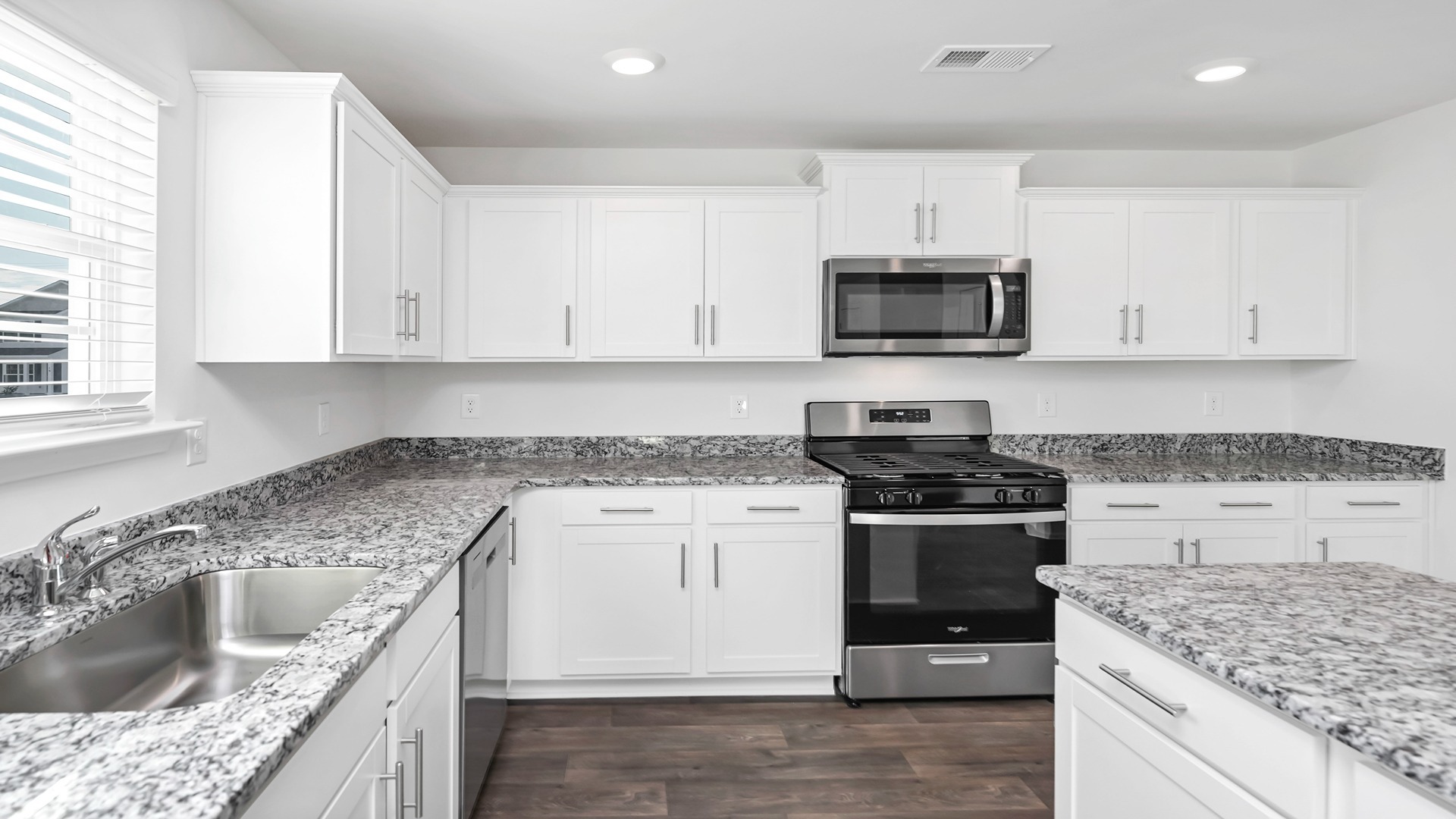 Modern granite countertops finish the kitchen space