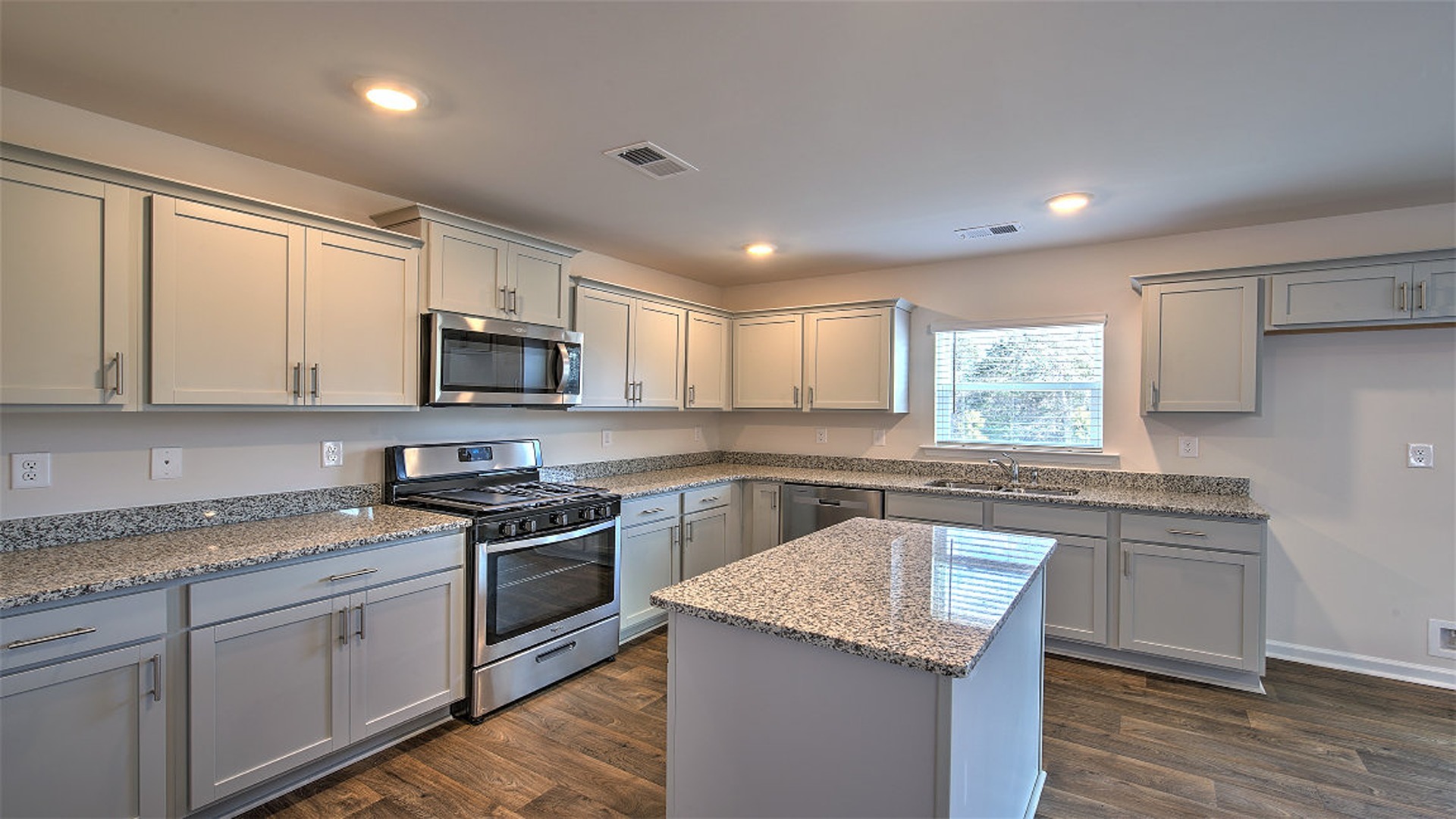 Harrison kitchen with gray cabinetry and granite countertops