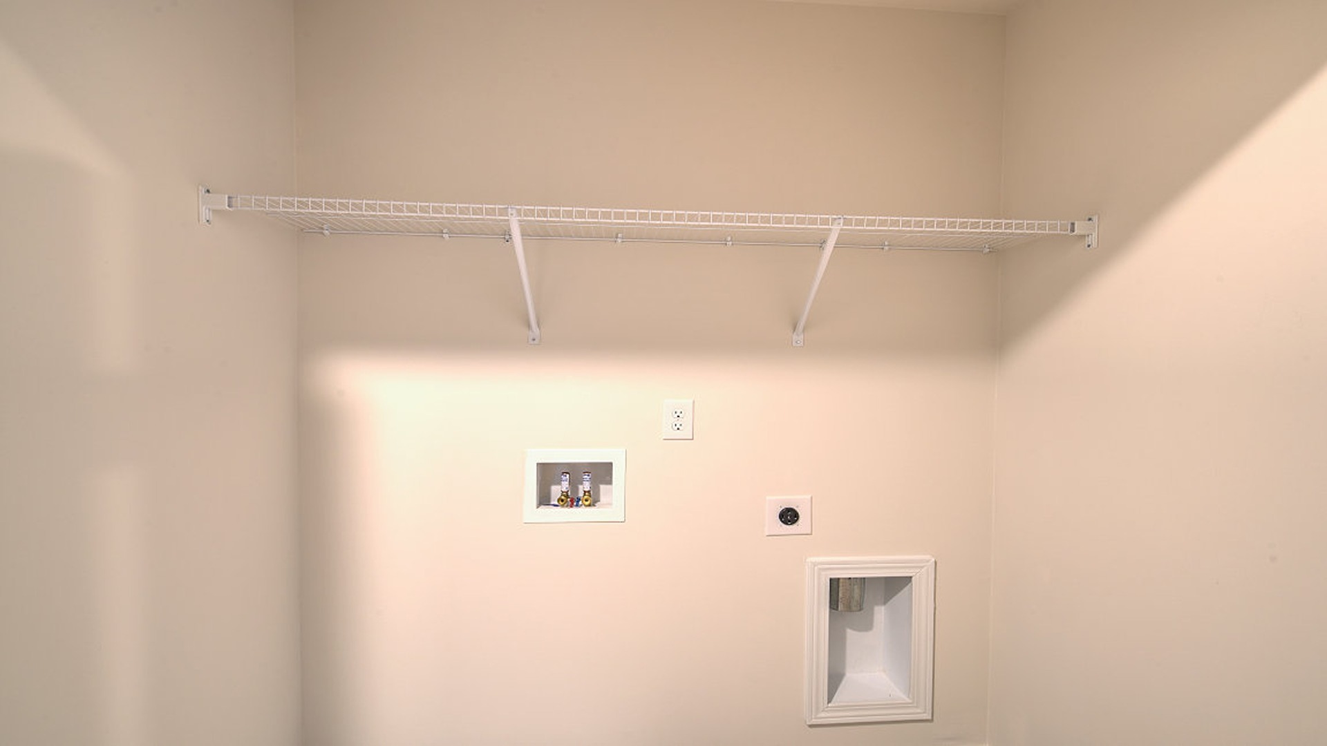 Landry room upstairs with wire shelving
