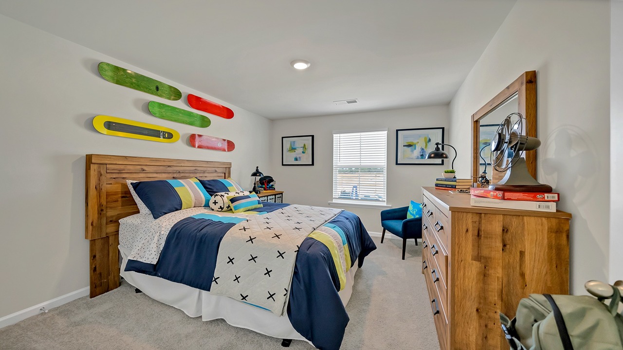 Bedroom 2 with a window and carpet flooring