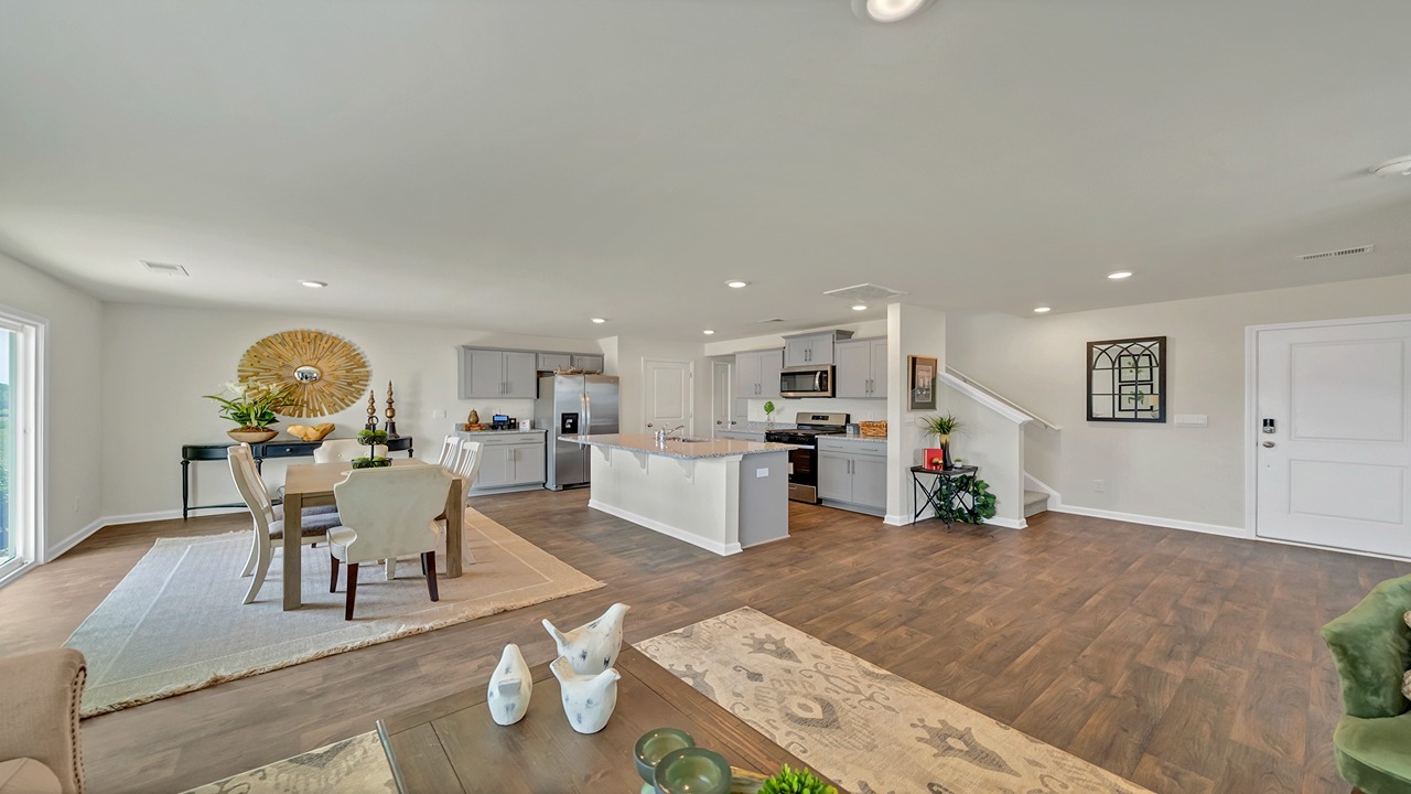 Open concept kitchen, dining, and living areas