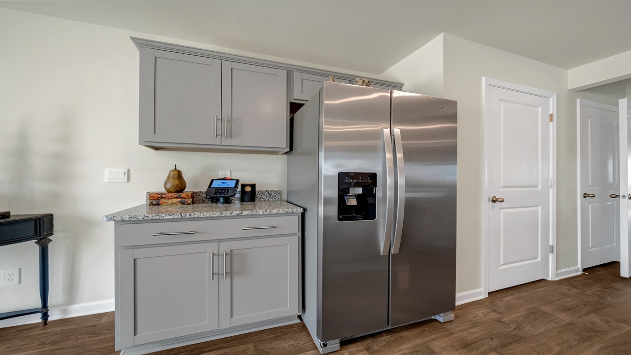 Spacious kitchen pantry by refrigerator