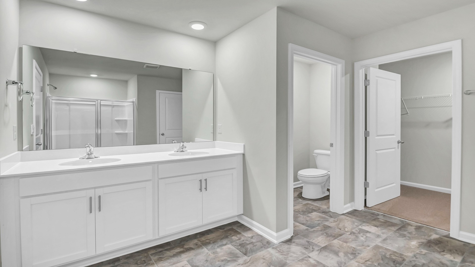 Double primary vanity with white cabinetry