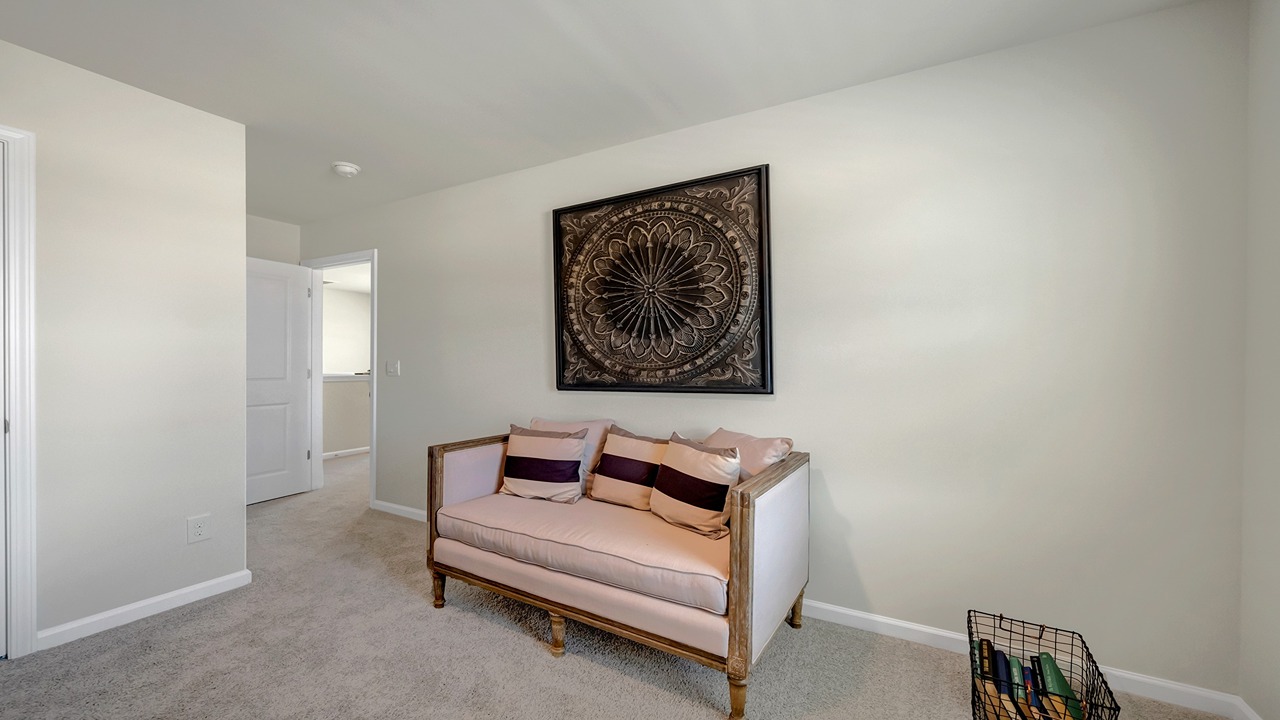 Bedroom 3 upstairs with carpet flooring and a window