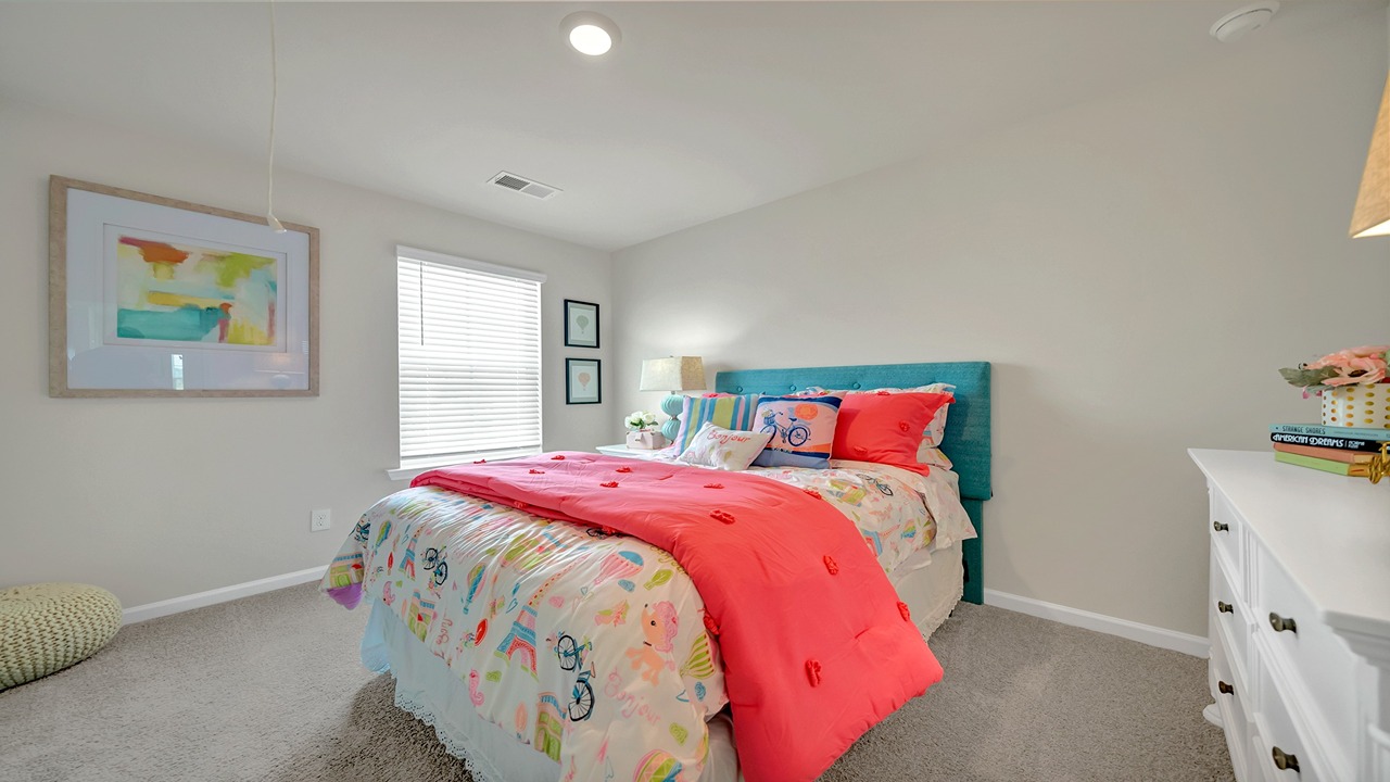 Bedroom 4 with carpet flooring and a window