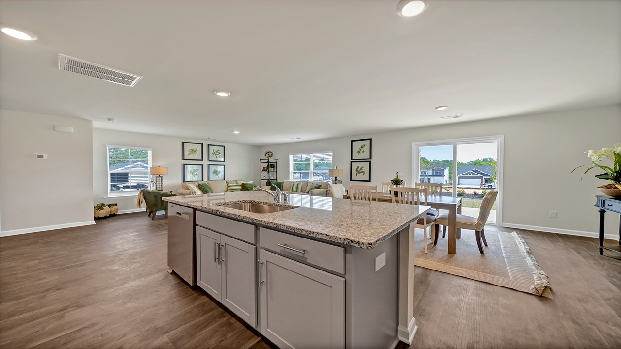 Floating kitchen island overlooking dining and living area