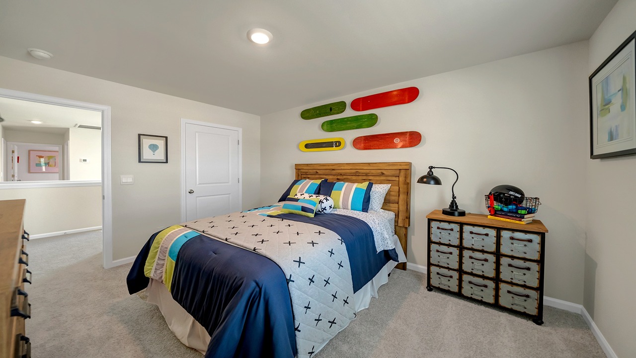 Bedroom 2 with carpet flooring and a private closet