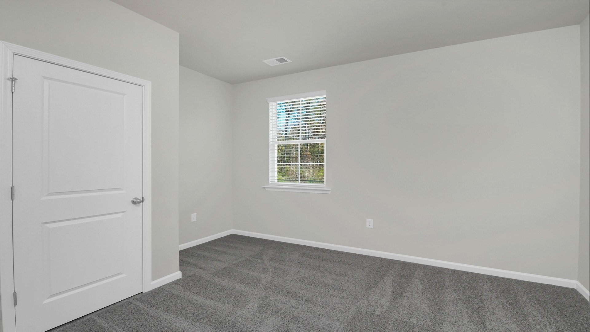 Bedroom 2 downstairs in the Robie floorplan with a window for light