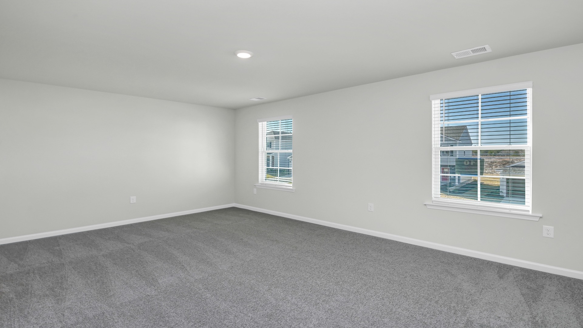 Spacious, bright primary suite upstairs with natural light in the two-story Robie floorplan