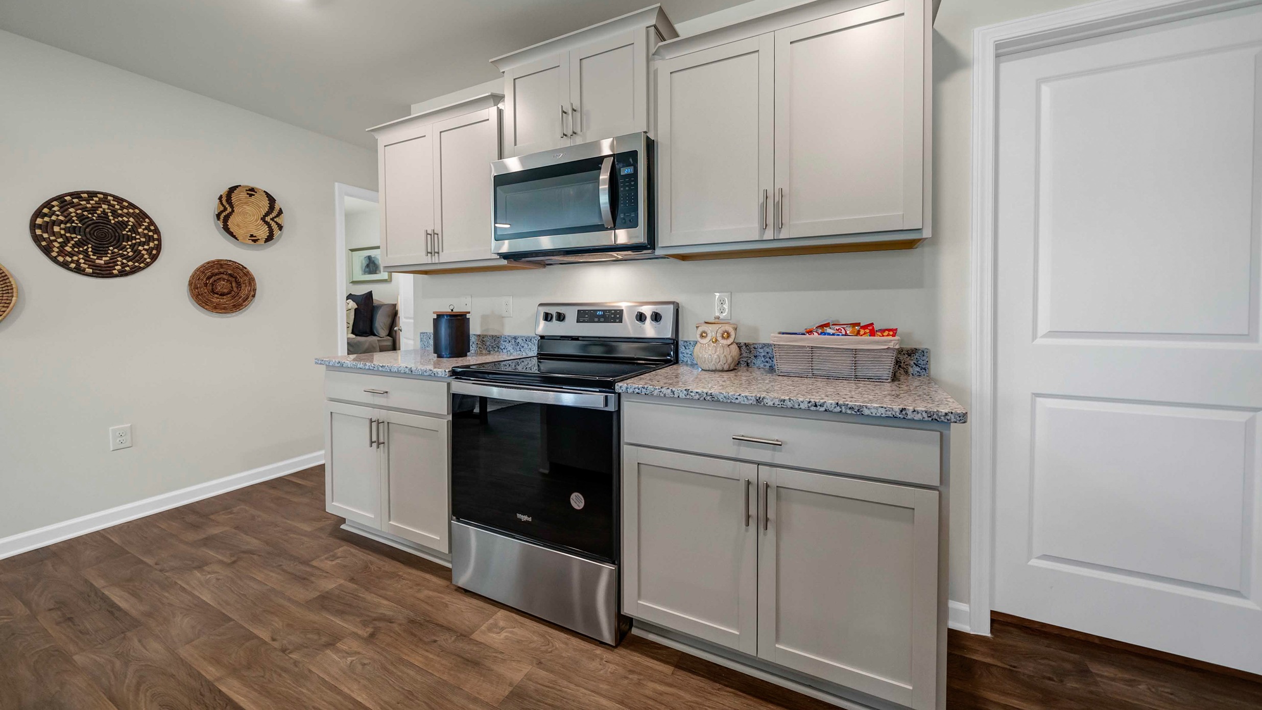 Gray cabinetry in modern kitchen in new construction home in Hopkins, SC