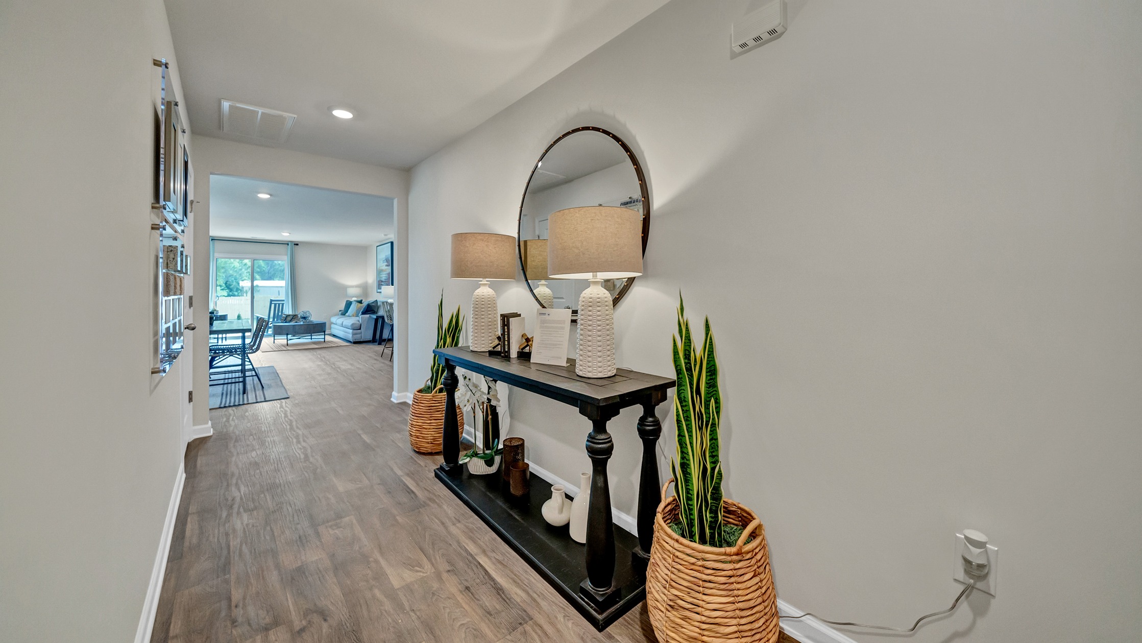 Entrance through the front foyer leads into the open main living areas of the Robie floorplan