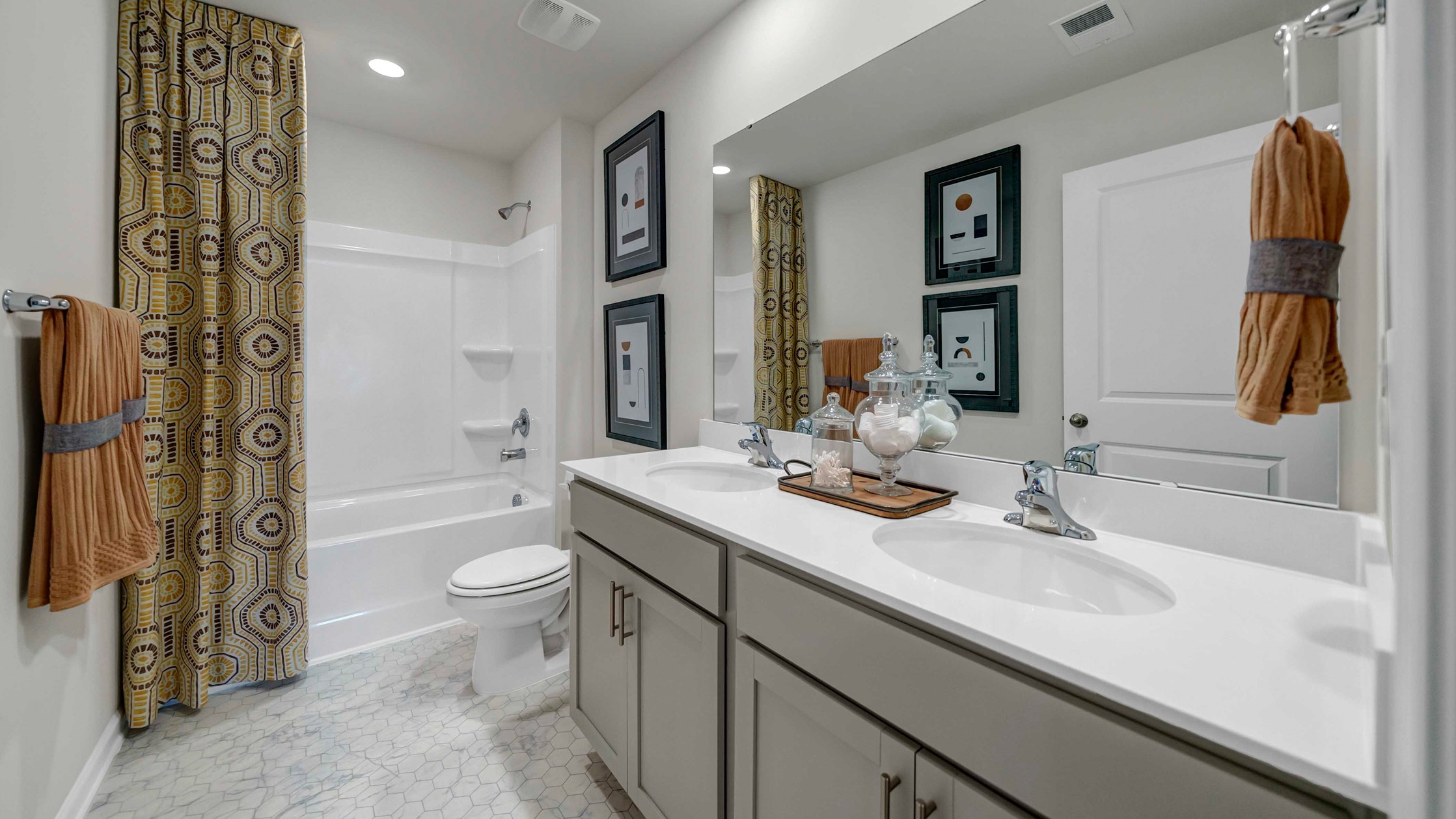 Bathroom 3 upstairs with a double vanity and shower tub combo