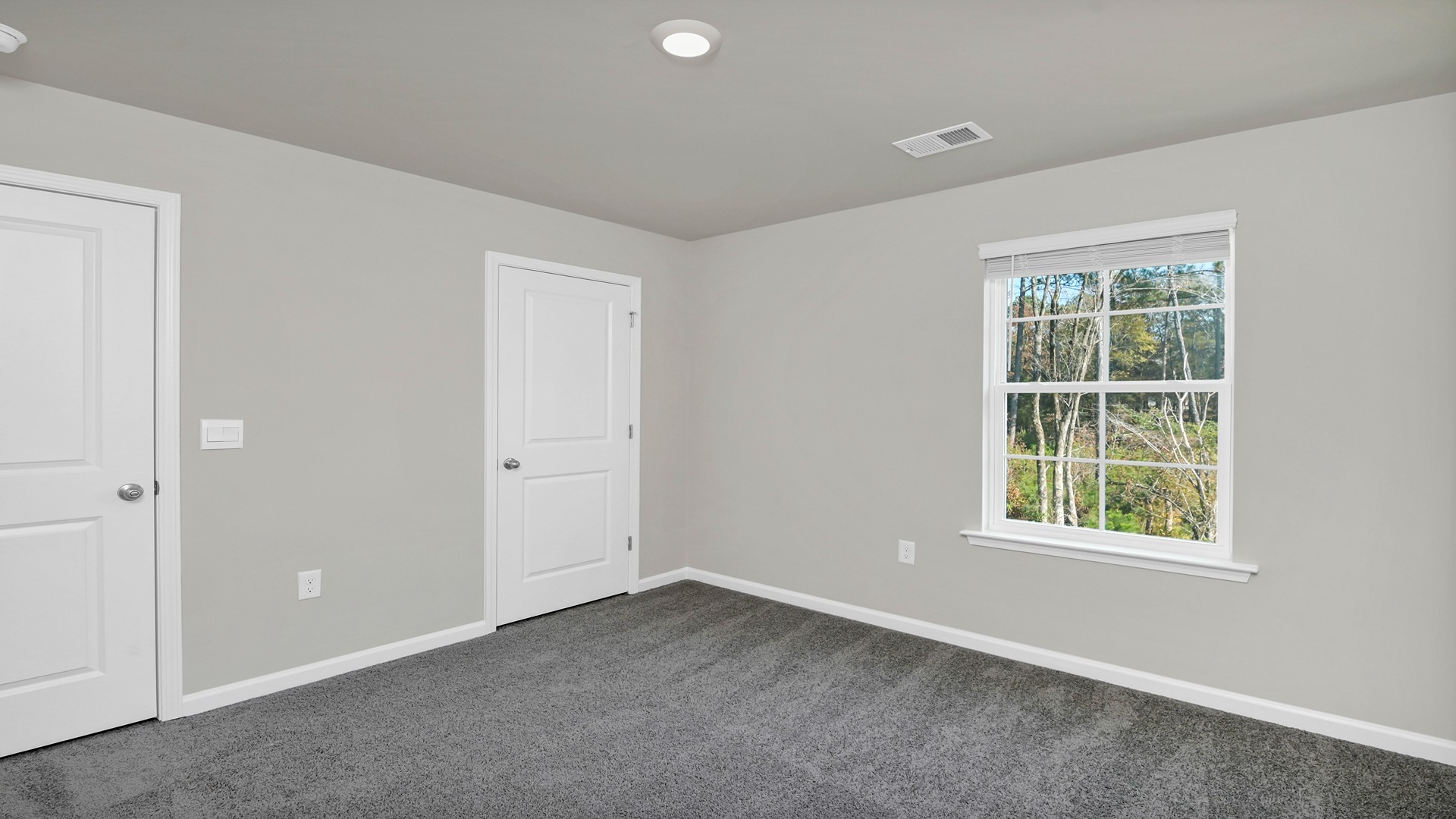 Bedroom 4 with a private closet and neutral painted walls