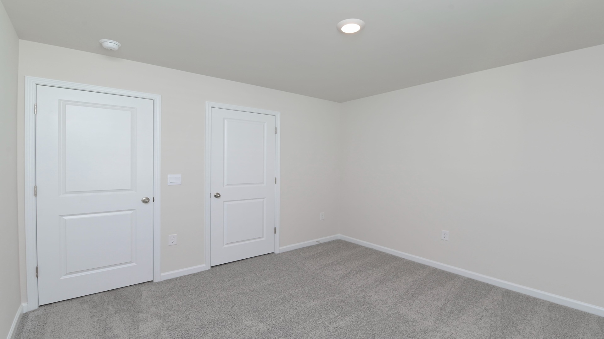 Bedroom 3 private closet and carpet floors in the Robie Floorplan