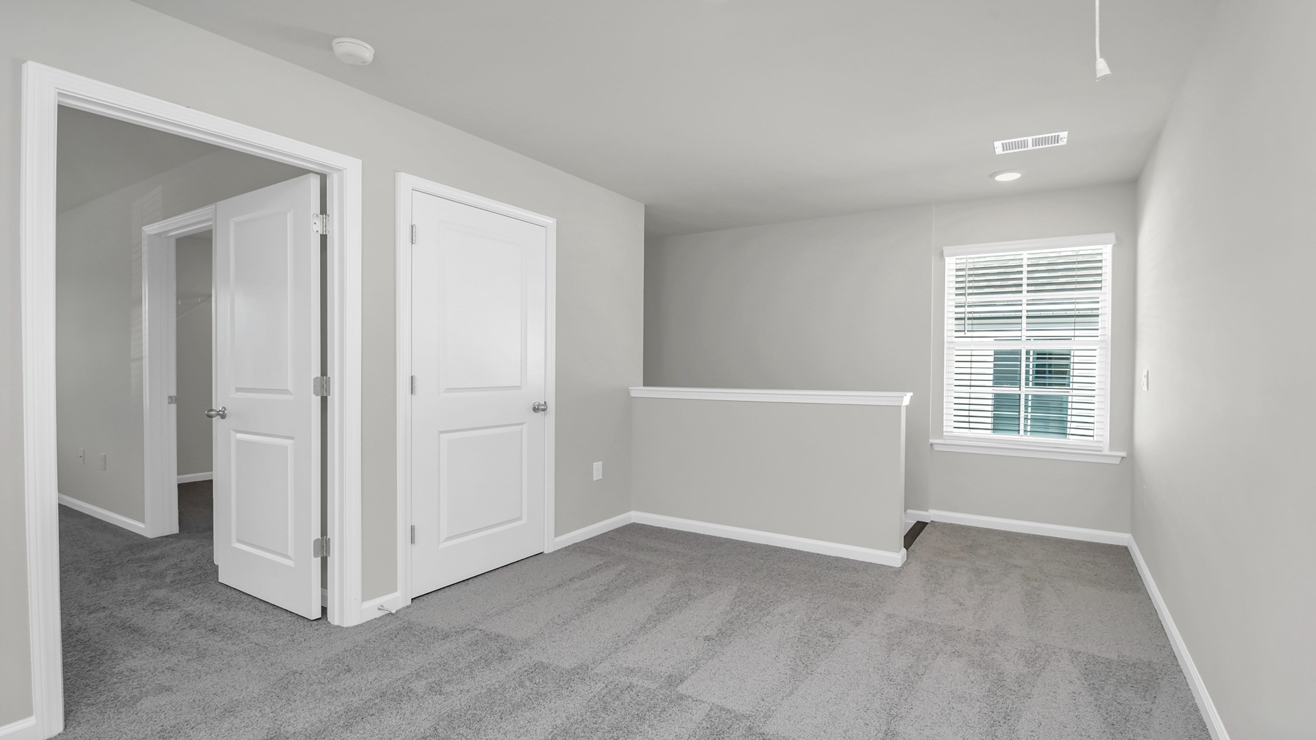 Upstairs landing with a window for light and a small upstairs loft space