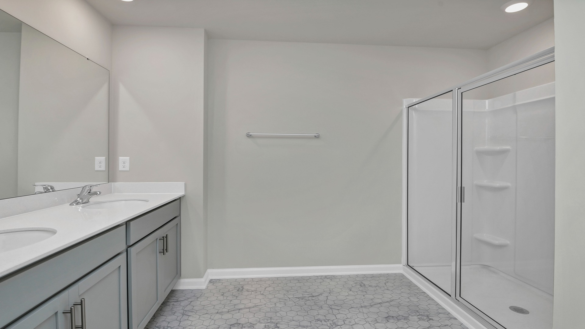 Walk-in shower in primary bathroom of the Robie