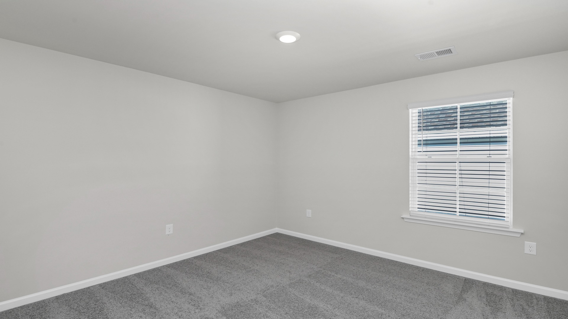 Bedroom 3 with a window for light and carpet flooring