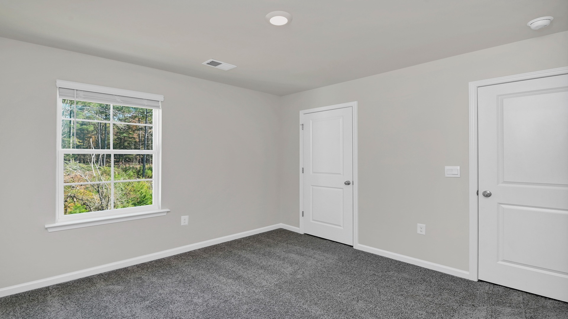 Bedrooms upstairs have windows for light, carpet flooring, and private closets