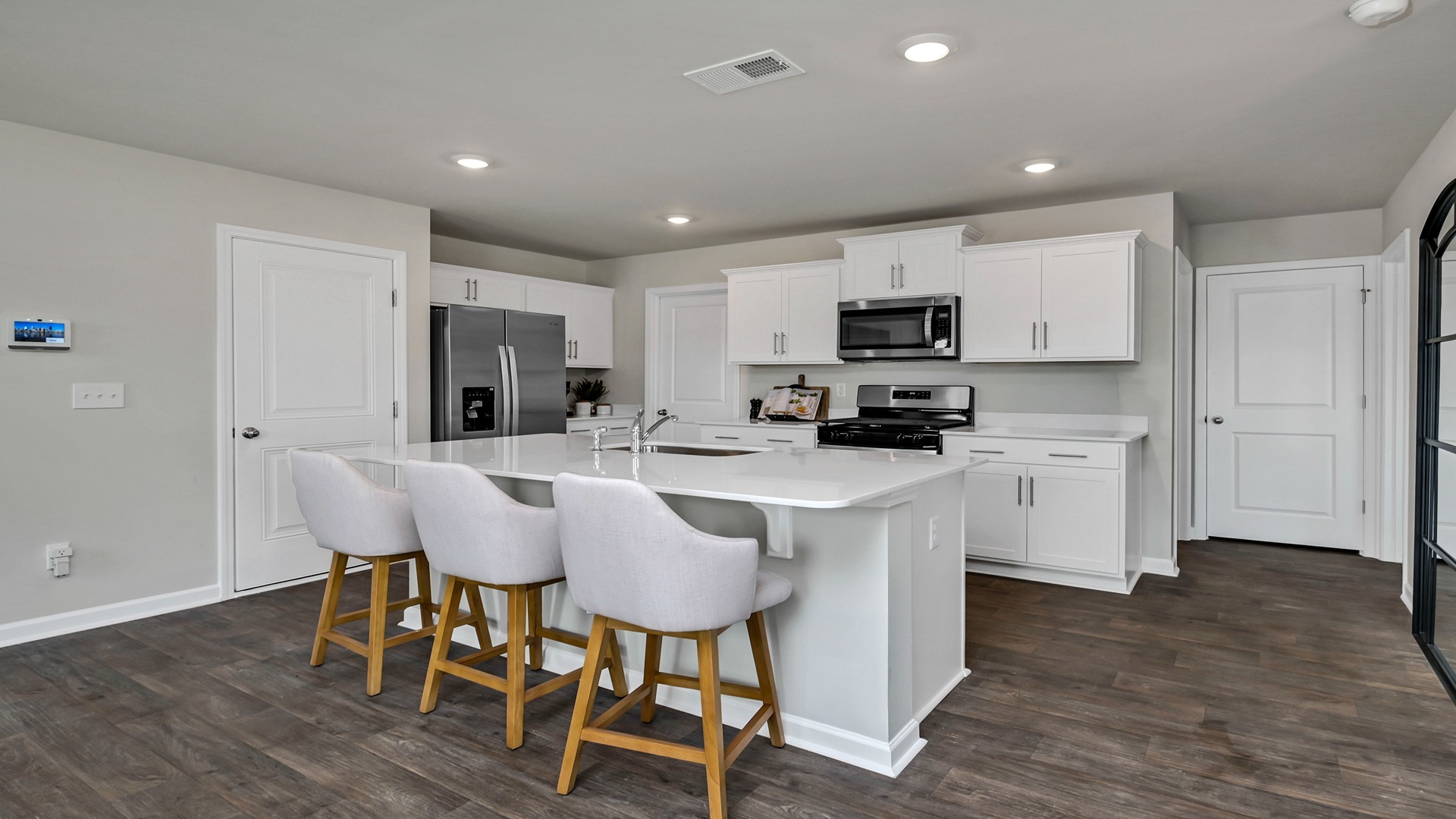 Modern kitchen in new construction home with quartz countertops