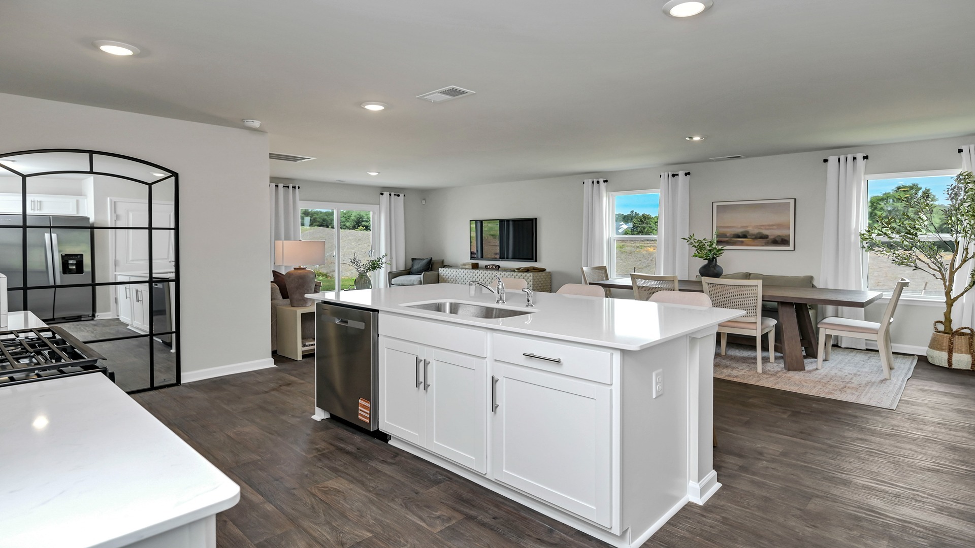 Floating island overlooks the dining and living areas on the first floor of the Robie floorplan