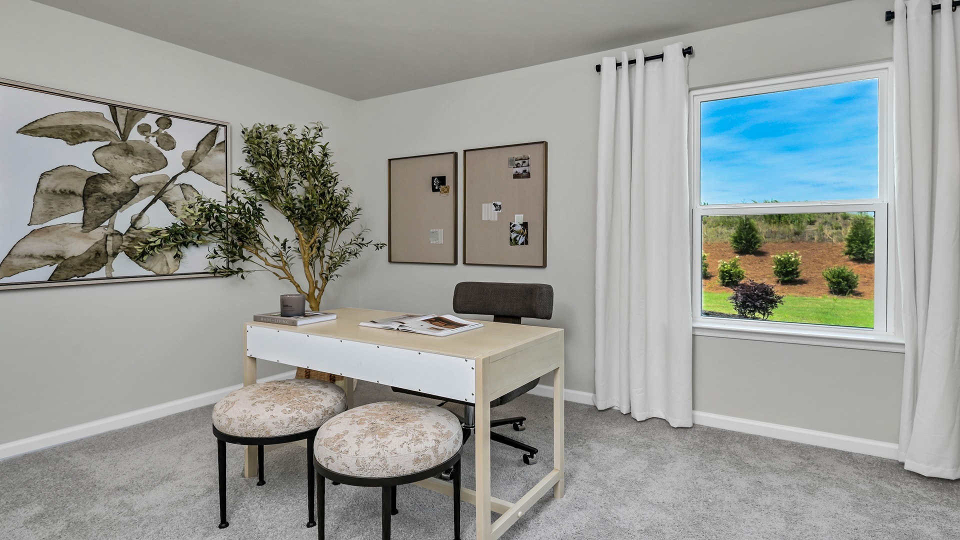 Downstairs bedroom with carpet flooring and a window for light