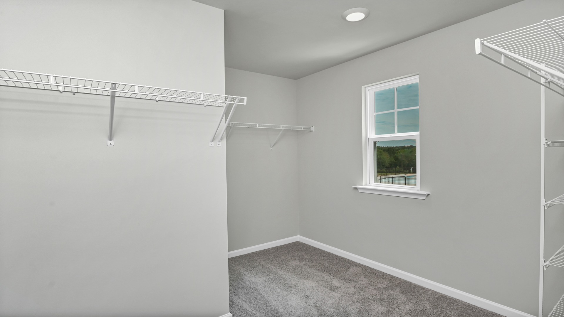 Large primary closet with window for light