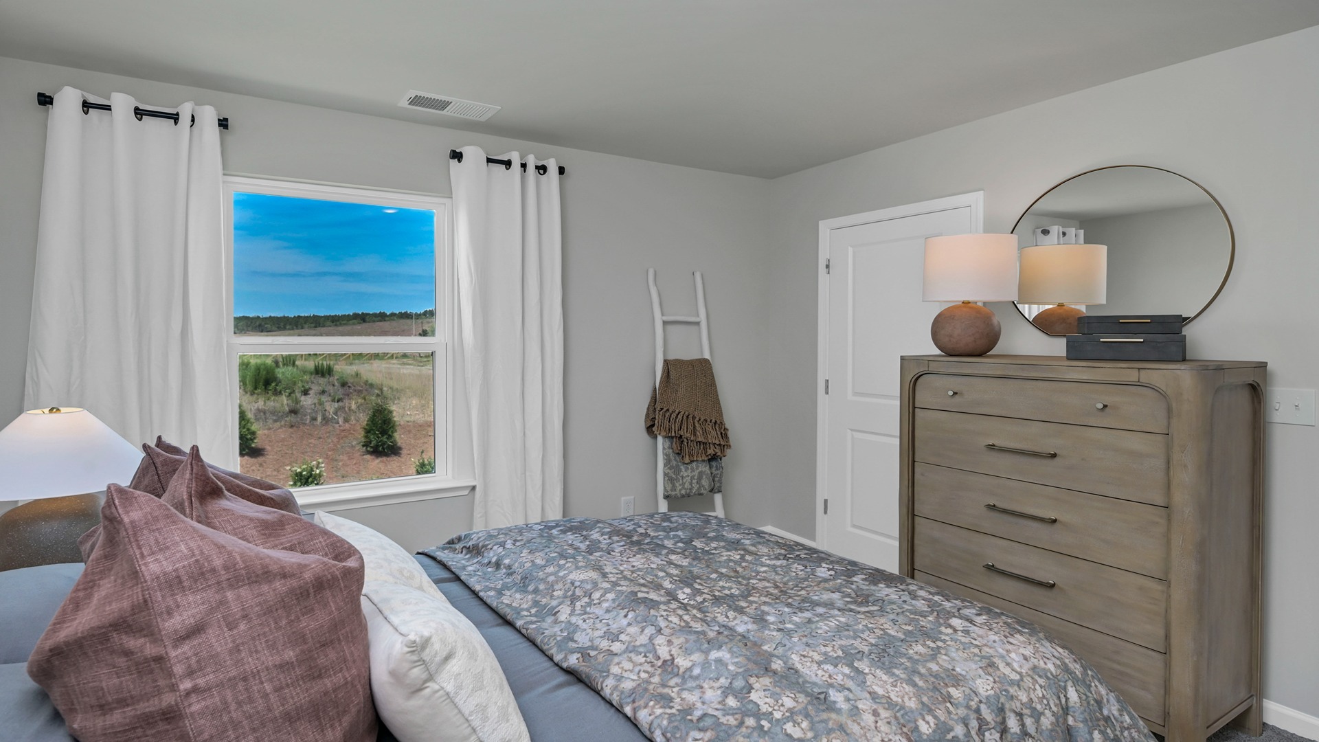 Upstairs bedroom 3 with window and carpet flooring