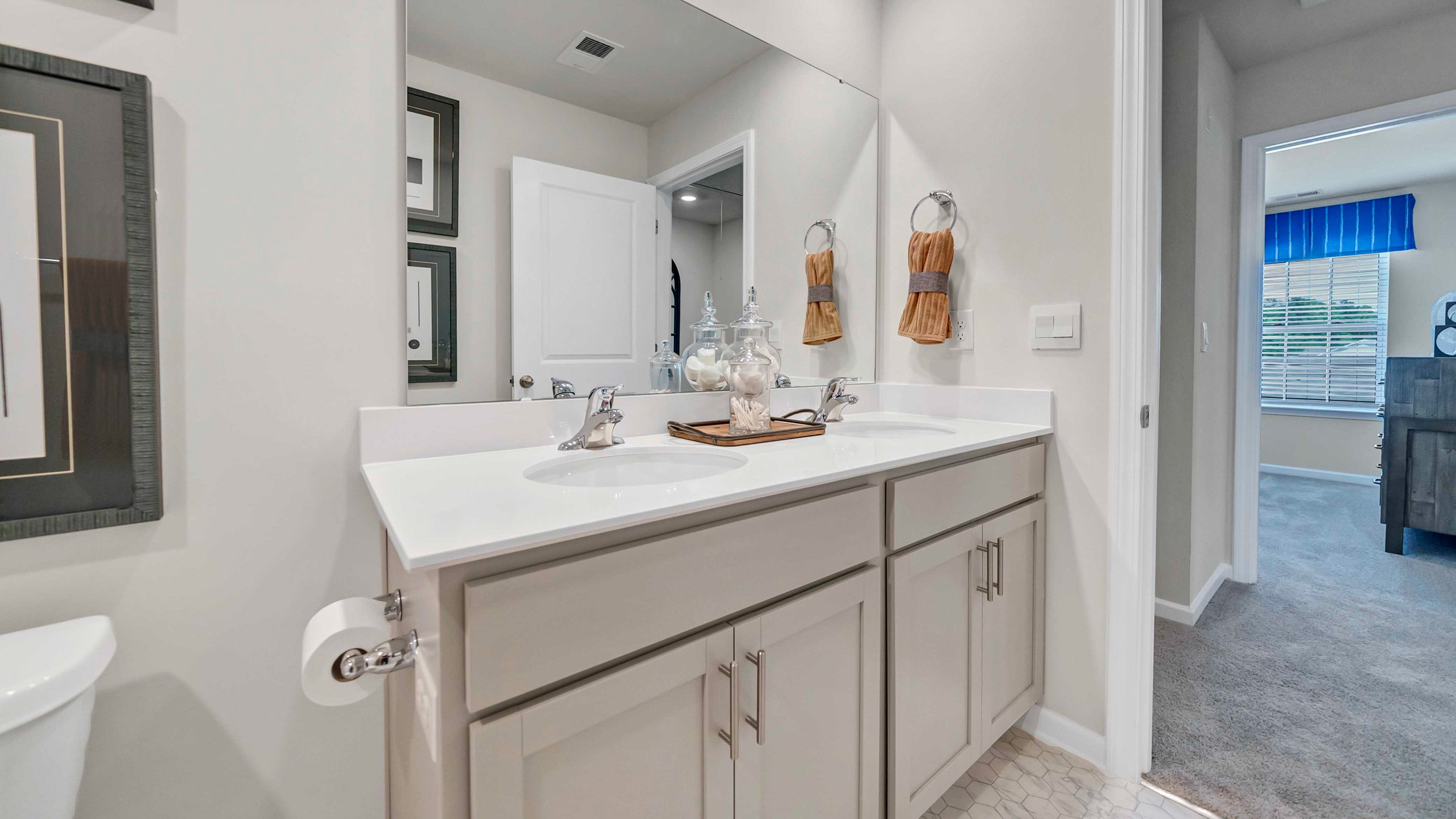 Bathroom 3 upstairs with a double vanity