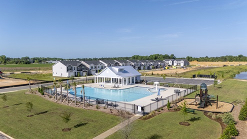 Resort-style pool, cabana, and playground amenities.