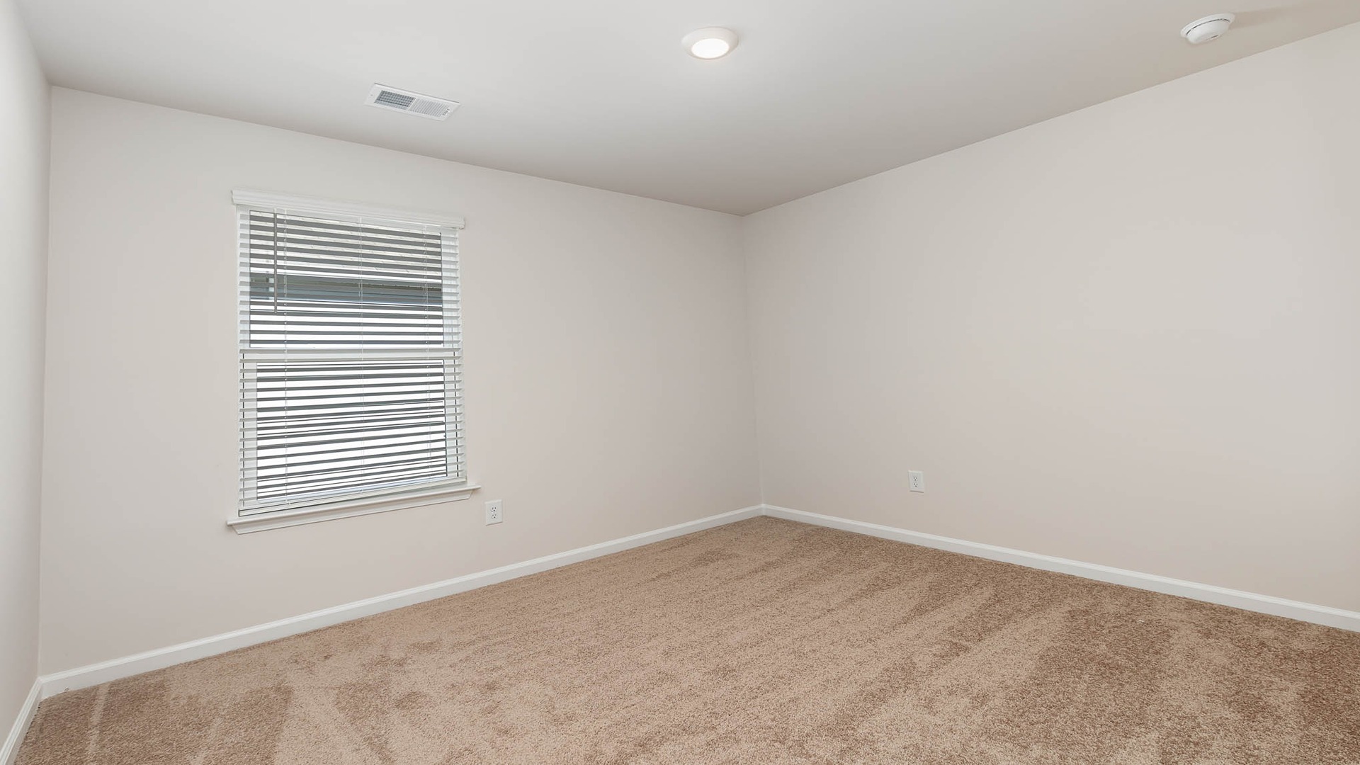 Bedroom 3 with a private closet and a window for light