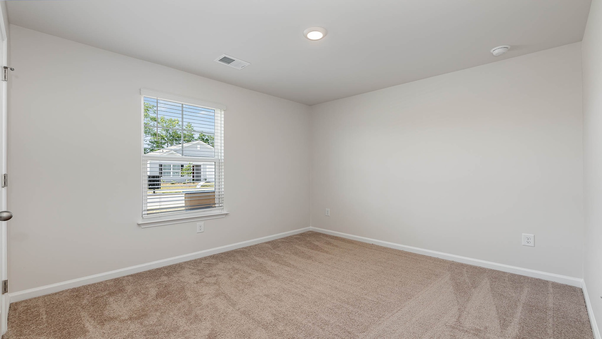 Bedroom 2 with carpet flooring and a private closet