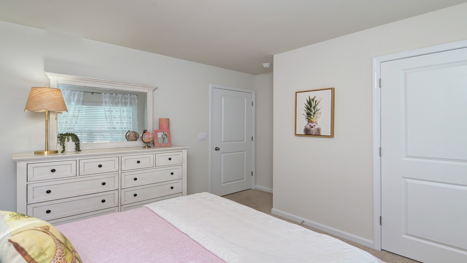 Front bedroom 2 with carpet flooring and a window