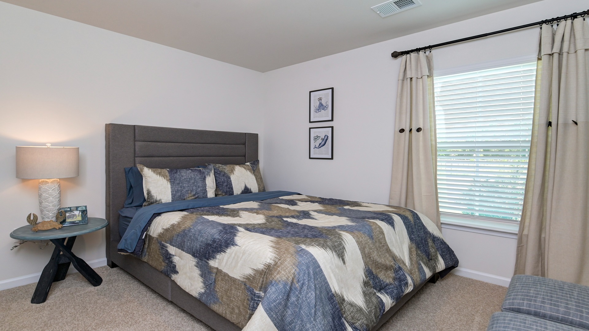 Bedroom 3 with carpet flooring and a window for light