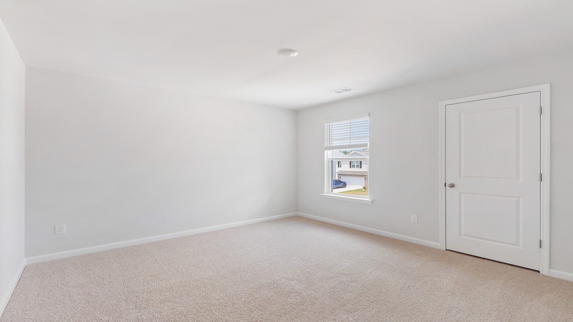 Bedroom 4 upstairs with carpet flooring and a window