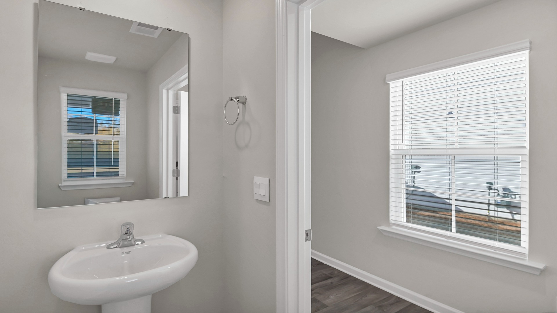 Convenient first-floor powder room in front foyer